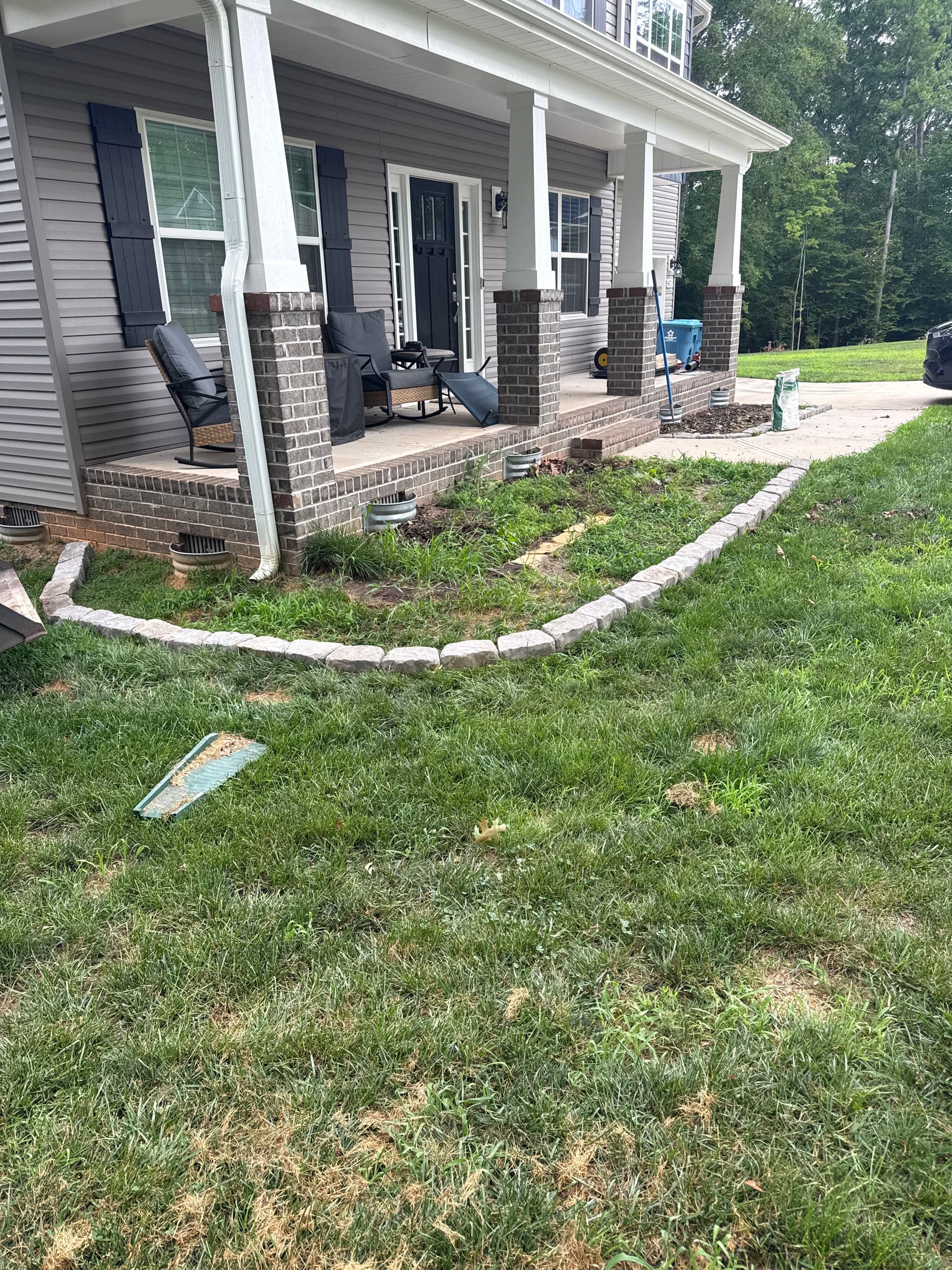 Front Yard Landscape Bed Renovation with Fresh Mulch and Stone Edging image