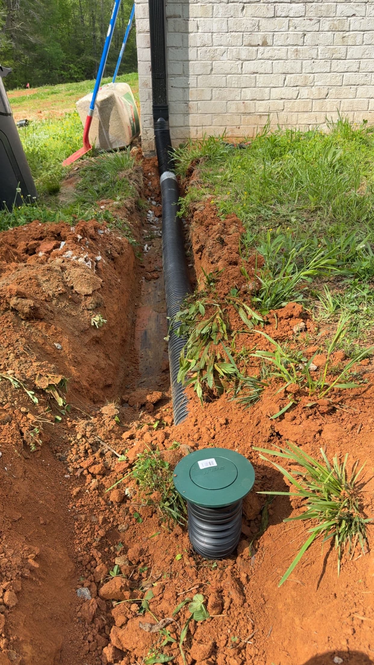 Project Buried Downspout Drain Keeps Water Away From the Foundation image