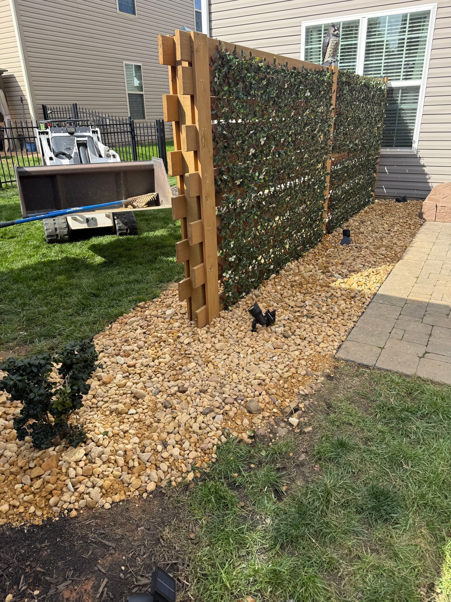 Transform Your Yard with River Rock Installation image